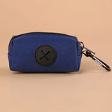 Vertex Select canvas dog poop bag holder, compact and portable pet supply with eco-friendly design, shown in black with attached bag rolls.