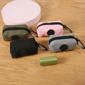 Vertex Select canvas dog poop bag holder, compact and portable pet supplies with environmentally friendly design, shown in close-up.