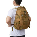 Unisex Vertex Select tactical backpack made of waterproof, wear-resistant fabric with multiple compartments and adjustable straps.